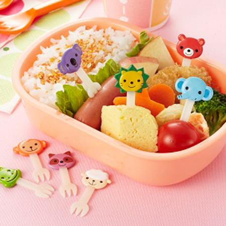 Animal themed fork picks used in a kids bento lunch to decorate and hold food pieces.