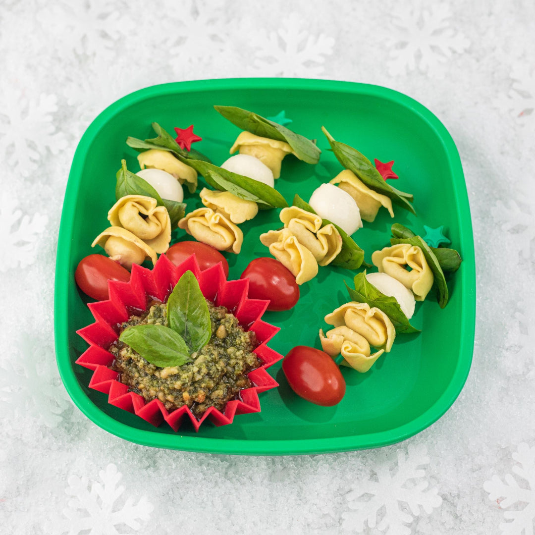 Kids Christmas‑plate and festive snacks made using the Lunch Punch Christmas cutters