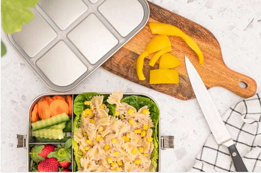 A healthy, balanced lunch packed in a stainless steel bento box with fresh fruit, vegetables, and pasta salad. Ideal for Australian families looking for durable, plastic‑free lunch solutions for school and everyday use.