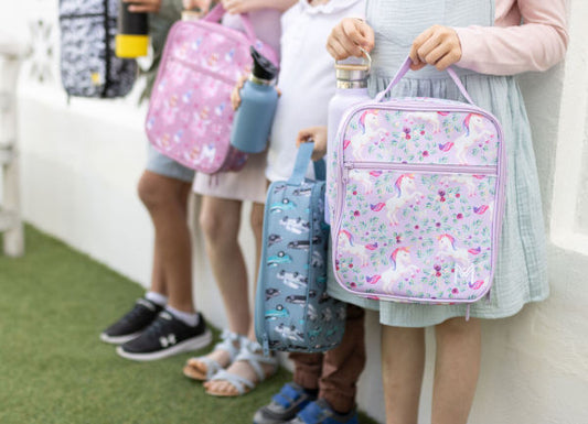kids holding lunch bag at school