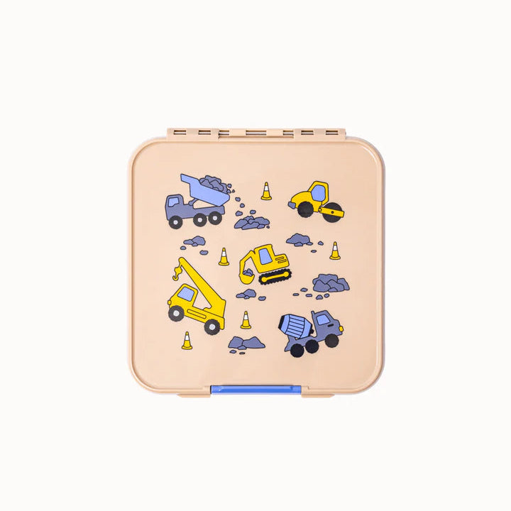 Top view of closed beige MontiiCo Bento 5 lunch box featuring a construction vehicle print with dump trucks, excavators, and cranes.