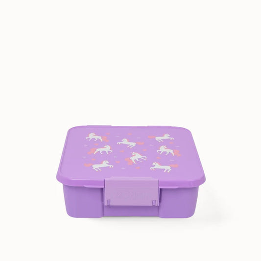 Front-facing angle of the closed purple MontiiCo Bento 5 Unicorn lunch box showing the secure latch closure.