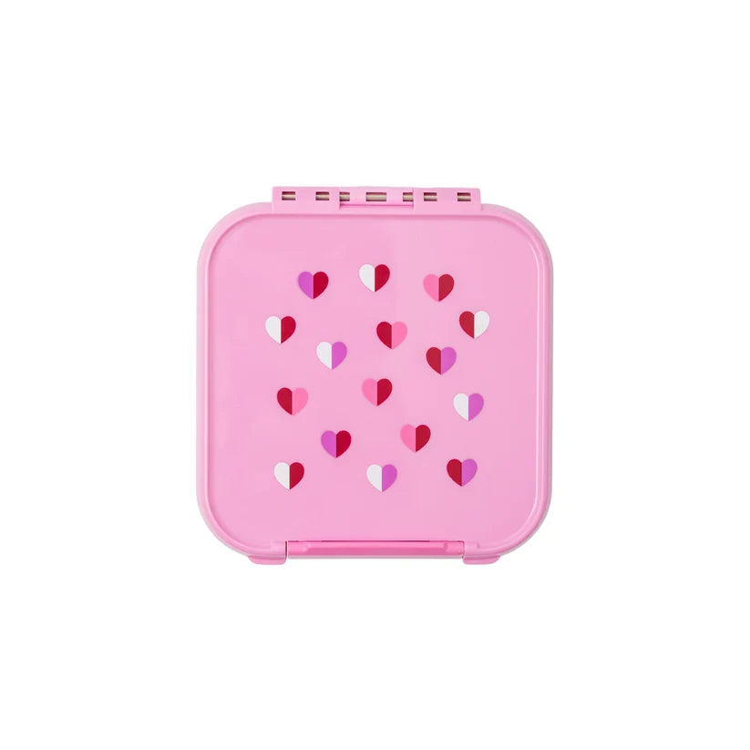 Top-down view of the closed pink MontiiCo Bento 2 snack box featuring the Sweetheart pattern of small pink, red, and white hearts