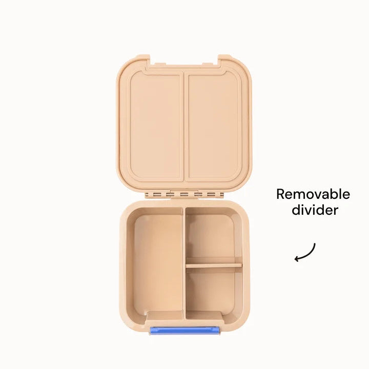 Overhead view of the open beige MontiiCo Bento 2 snack box highlighting the removable compartment divider.