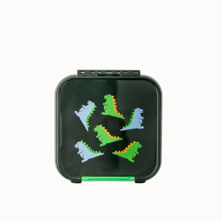 Top view of the closed MontiiCo Bento 2 snack box in dark green, featuring a colourful dinosaur pattern on the lid.