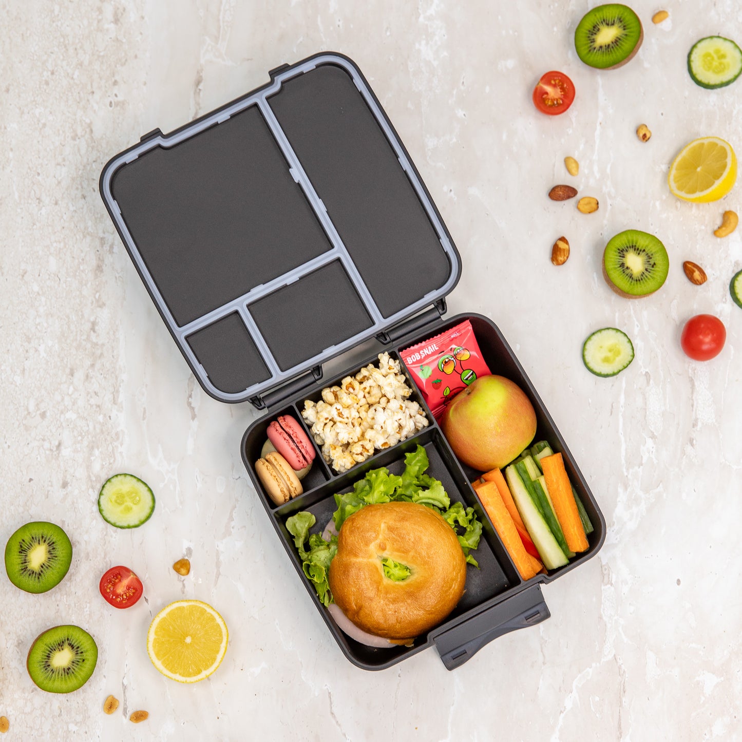 a picture of MontiiCo Feast Bento Lunch Box - Midnight on a white background suitable for a kids lunch box