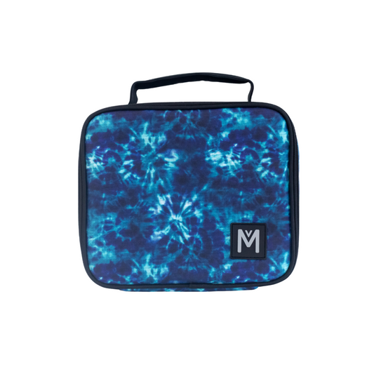 A medium-sized Montii.Co lunch bag with a blue geometric pattern and a visible Montii logo on the front.