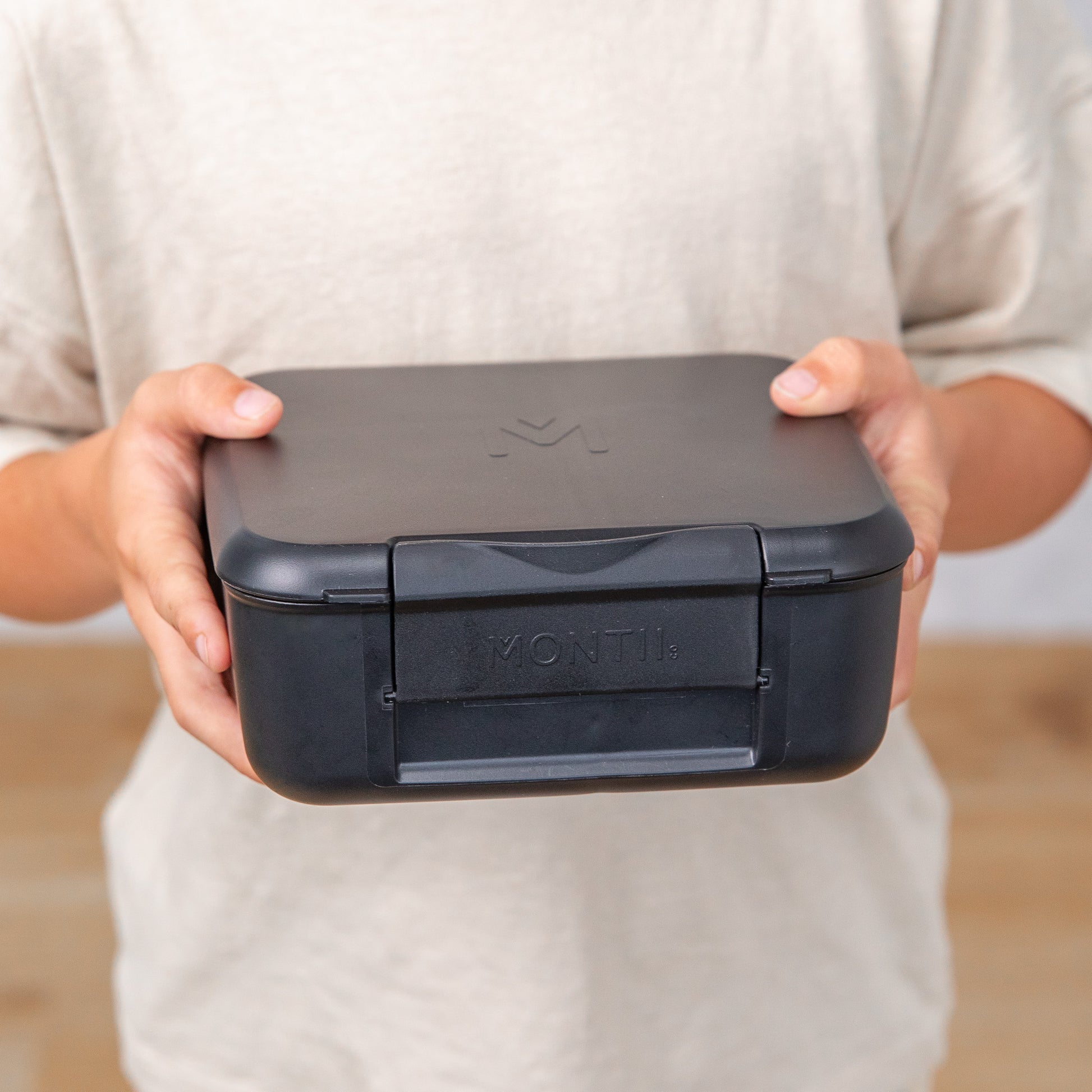 a picture of MontiiCo Feast Bite Lunch Box - Midnight on a white background for a fun bento meal