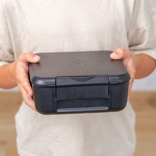 a picture of MontiiCo Feast Bite Lunch Box - Midnight on a white background for a fun bento meal