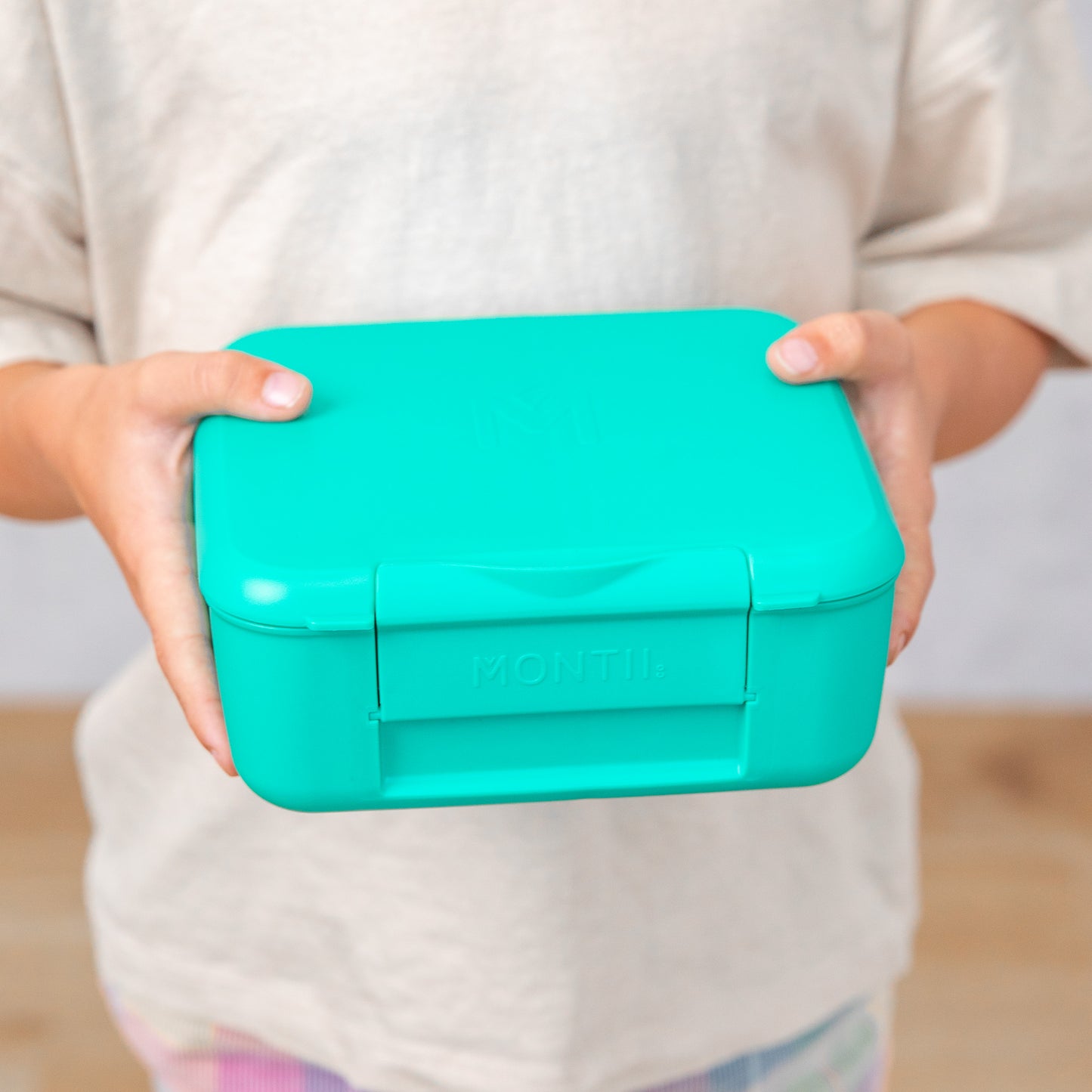 a picture of MontiiCo Feast Bite Lunch Box - Mojito on a white background for a fun bento meal
