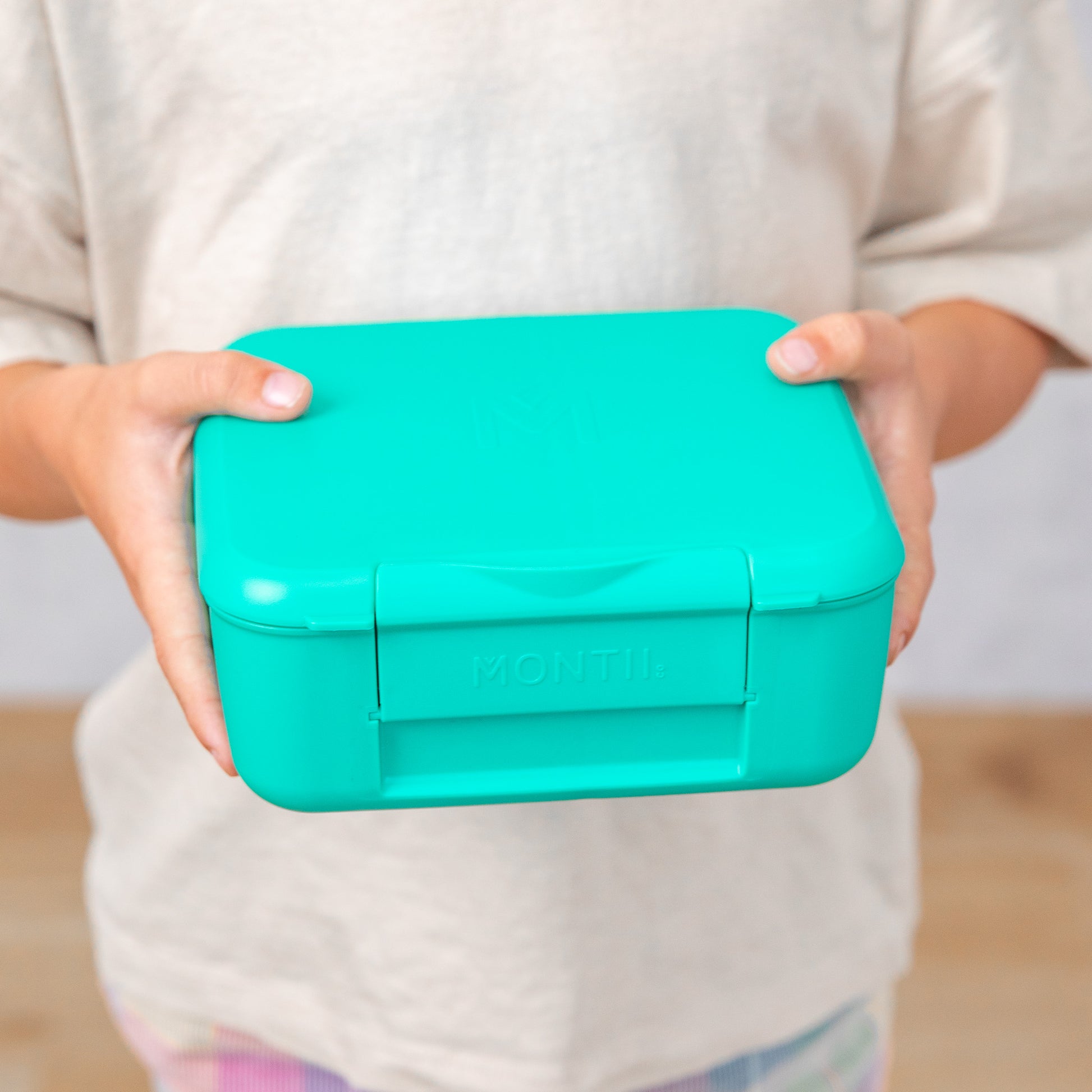 a picture of MontiiCo Feast Bite Lunch Box - Mojito on a white background for a fun bento meal