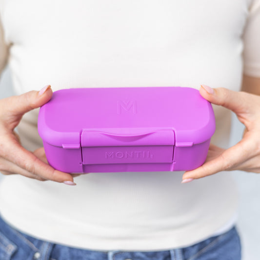 a picture of MontiiCo Feast Snack Box - Fuchsia on a white background for a fun bento meal