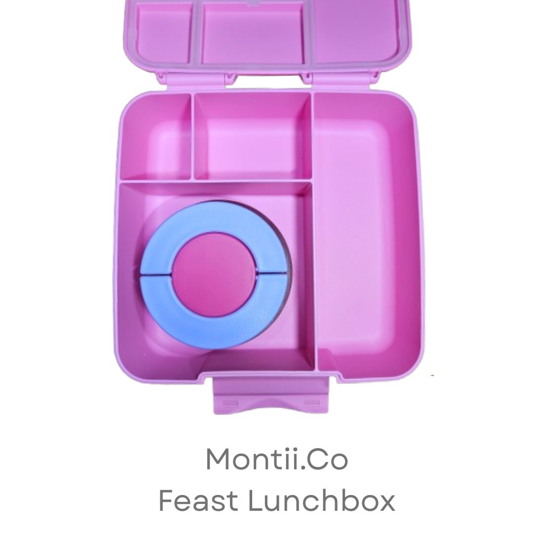 Pink MontiiCo lunchbox with compartments on a white background
