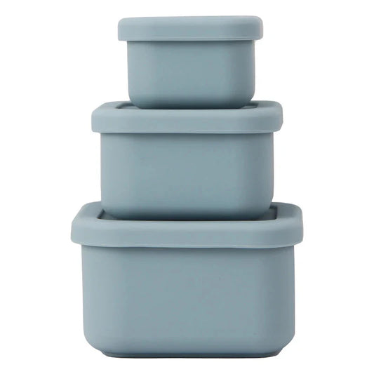 Three apollo blue silicone nesting containers of different sizes with lids, stacked together.