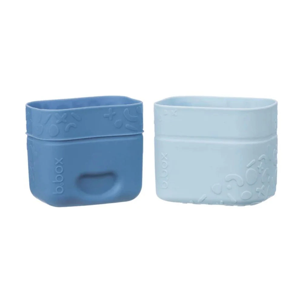 Two blue Ocean b.box silicone snack cups for organising snacks in kids’ lunchboxes.