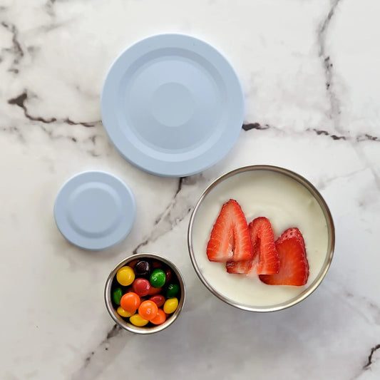 Ecococoon stainless steel snack pot set filled with yoghurt and fruit.