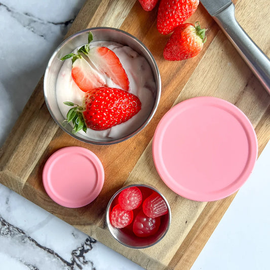 Ecococoon stainless steel snack pot set with rose‑coloured lids, shown stacked and filled, highlighting its durable metal bento‑style snack container design