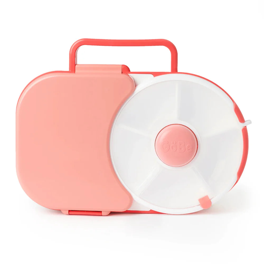 A GoBe Coral Pink Lunchbox with a white spinner compartment and a red carrying handle.