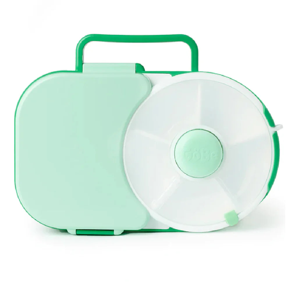 A mint green GoBe Lunchbox with a white spill-resistant snack spinner compartment and a carrying handle on the top.