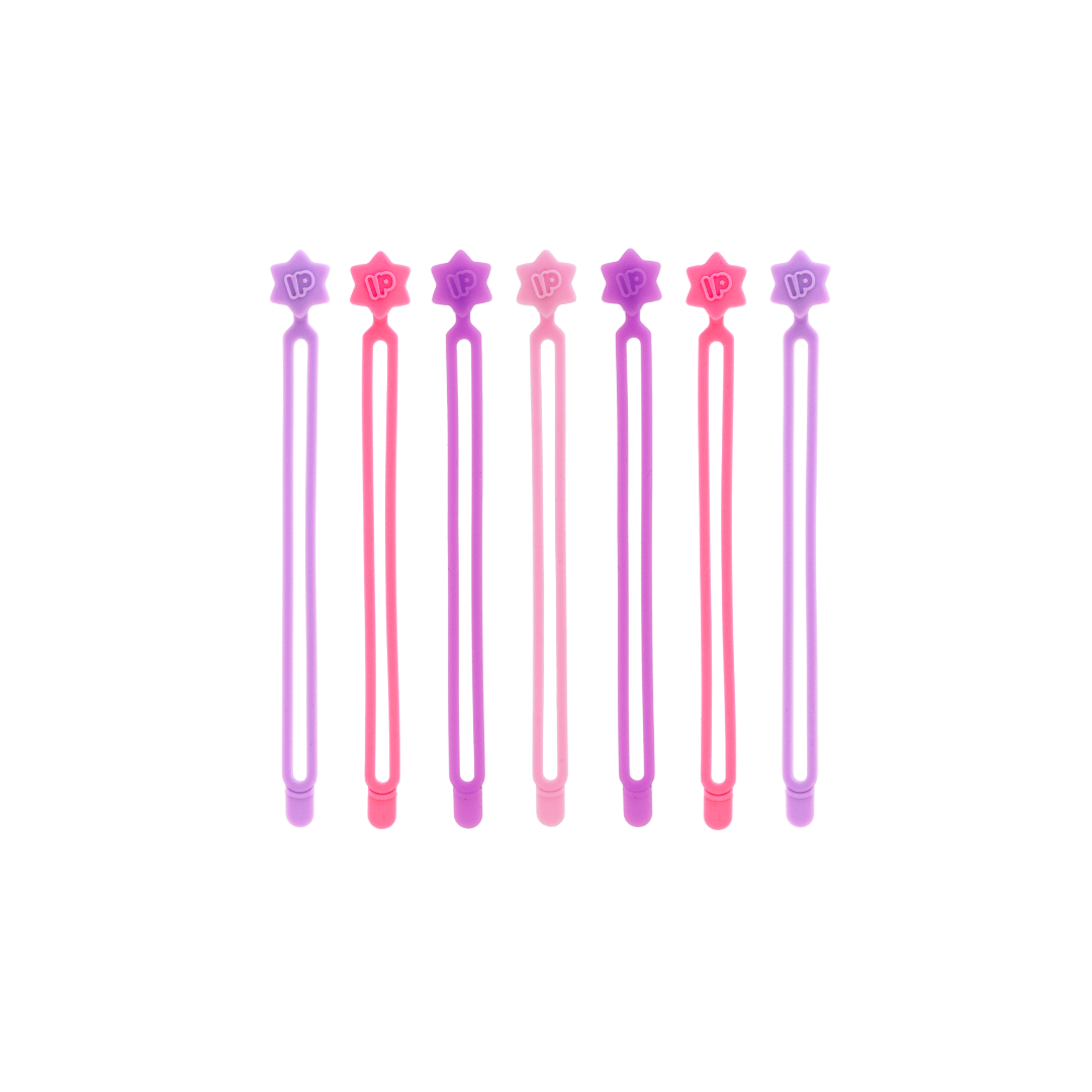 Set of six pink and purple hair sticks with star designs on a white background