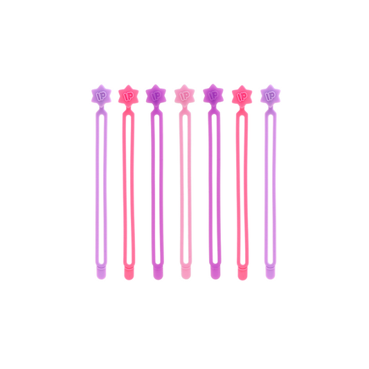Set of six pink and purple hair sticks with star designs on a white background
