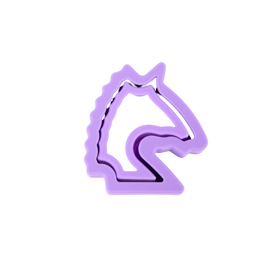 A purple, unicorn-shaped sandwich cutter.