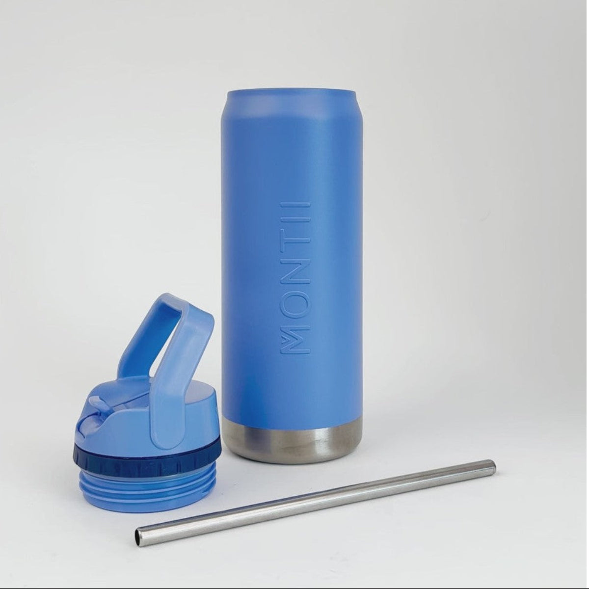 Blue insulated tumbler from Montii Co with lid and straw on a white background
