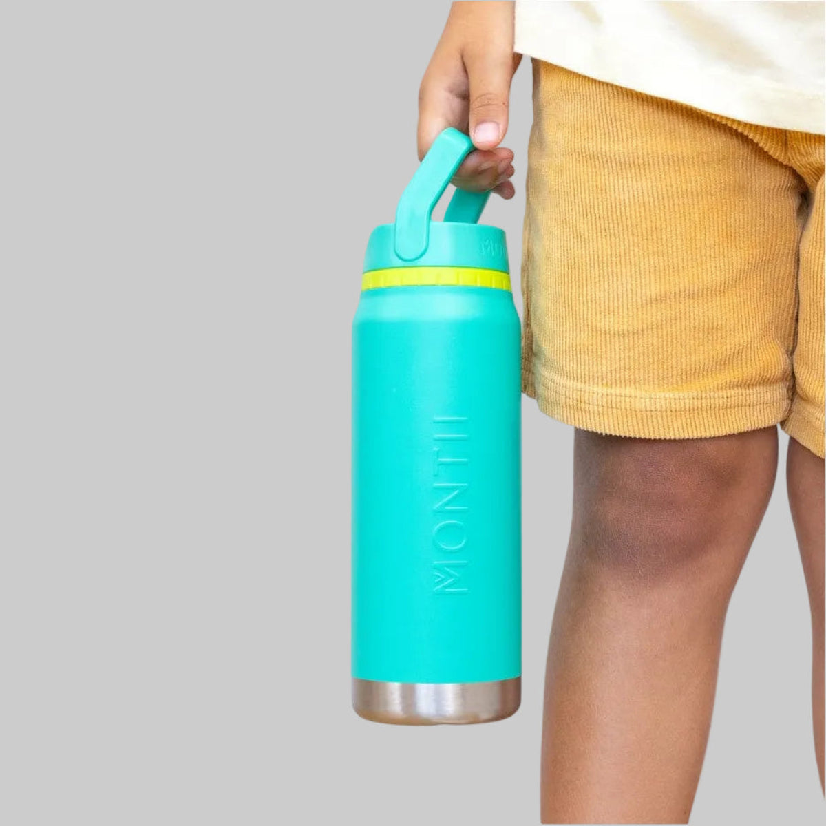 Person holding aMojito MontiiCo 750ml Sport Drink Bottle  with a yellow rim on a white background