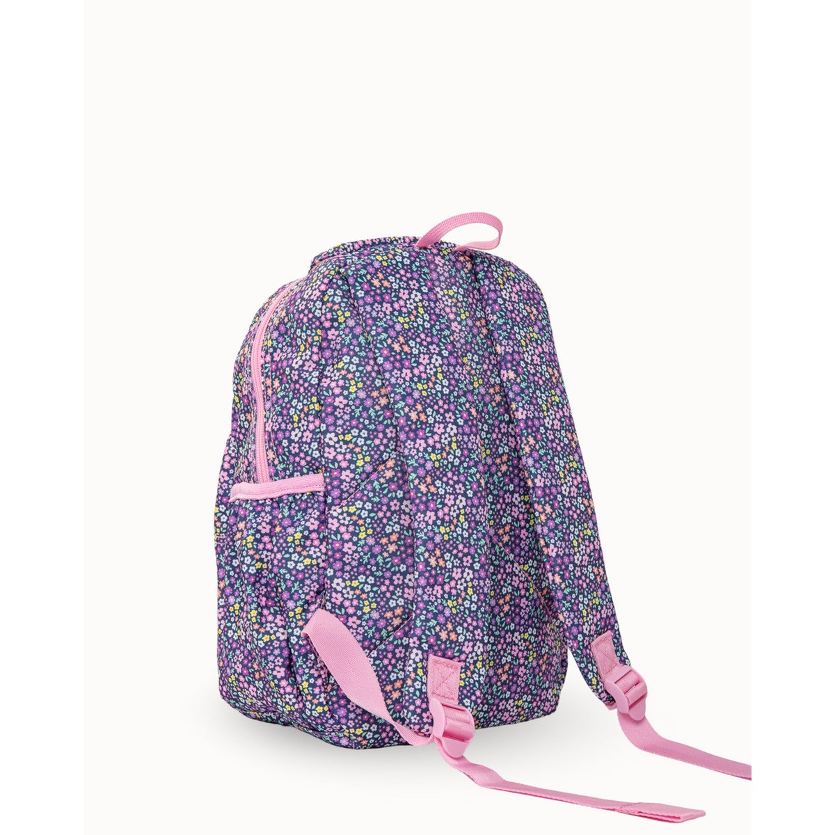 Meadow-patterned MontiiCo Mini Backpack with pink accents on a white background
