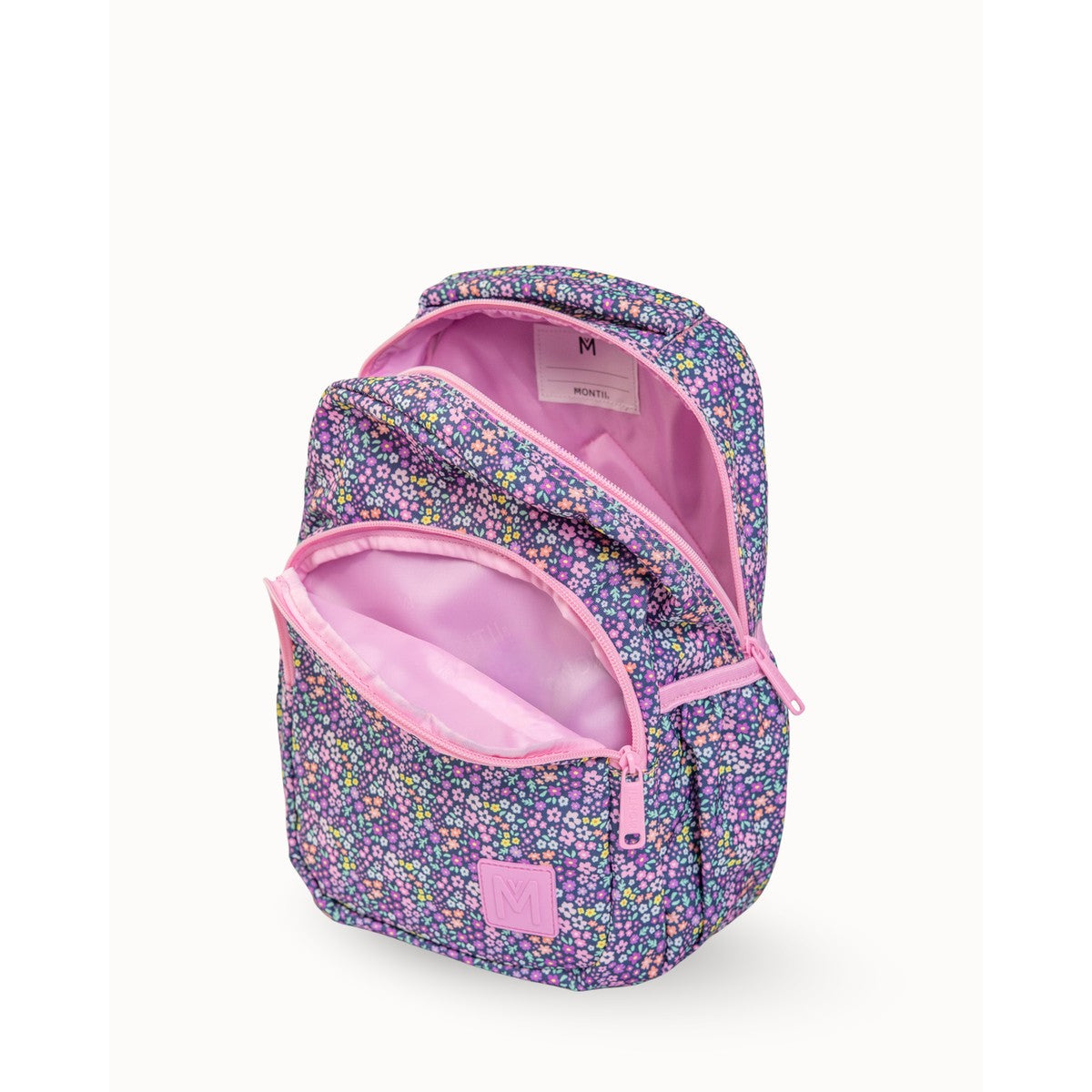 MontiiCo Mini Backpack - Meadow Floral-patterned backpack with pink interior on a white background