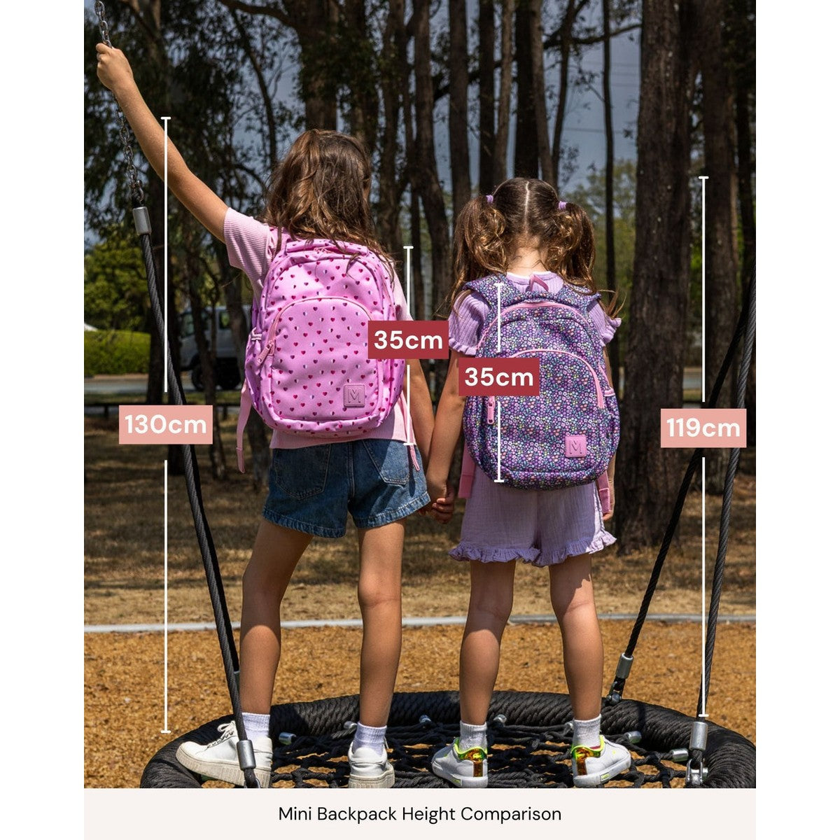 Two children standing on a playground with backpacks, showing height comparison measurements.