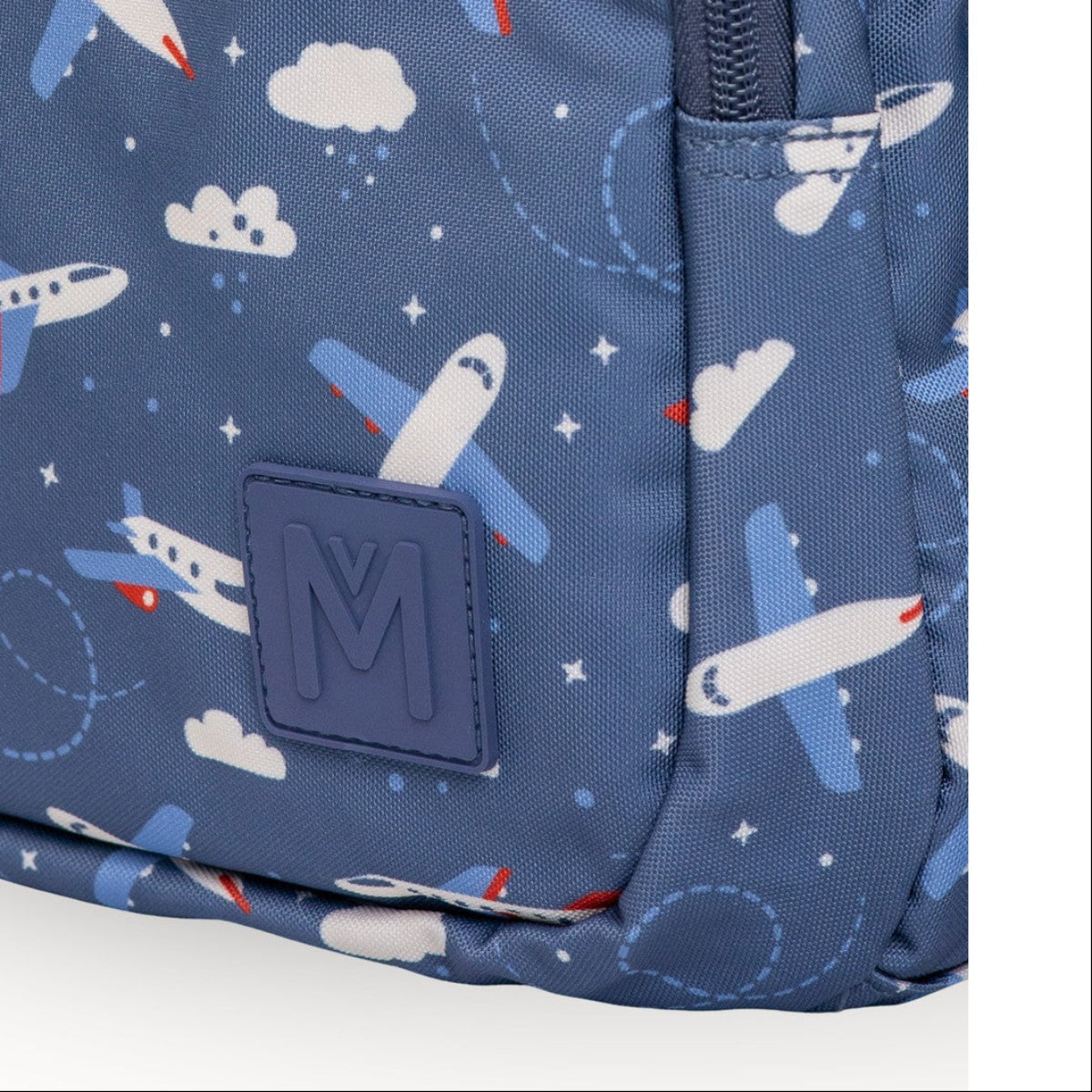 MontiiCo Mini Backpack - Jetset Blue backpack with airplane pattern and a visible brand logo on a white background