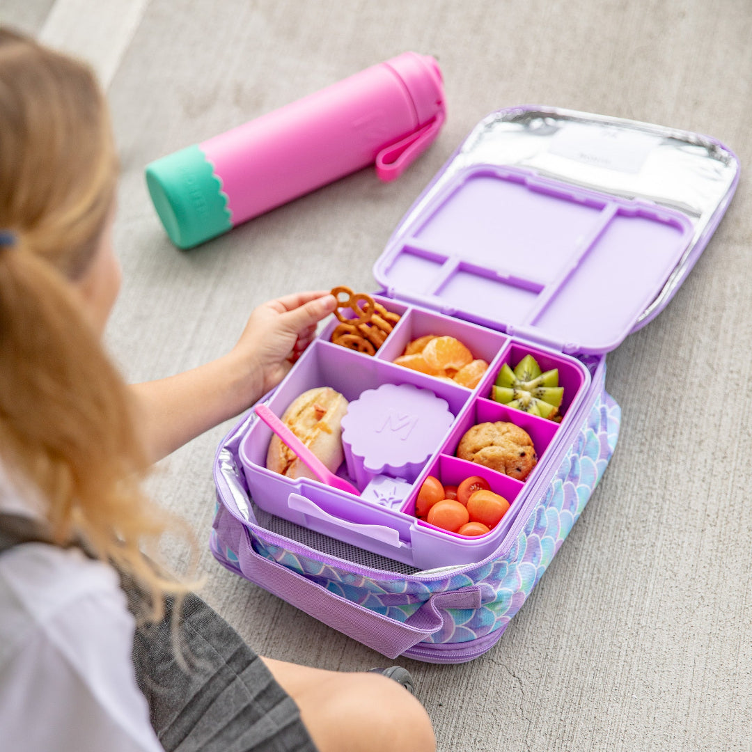 Fuchsia divided silicone tray; reusable tray containers for kids’ lunches.
