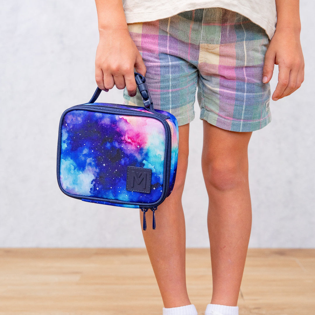 montiico mini starlight lunch bag shown being held by the handle to highlight size and portability