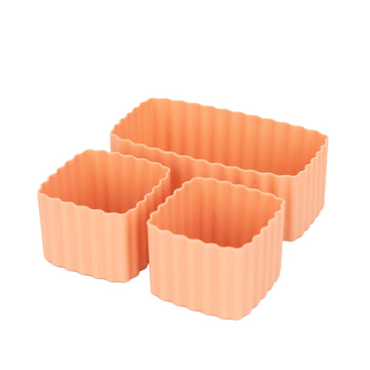 Set of beige dawn MontiiCo mixed bento cups with fluted sides, shown in multiple sizes for organising snacks in lunch boxes.
