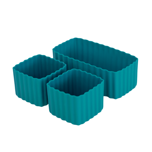 Set of pine green MontiiCo mixed bento cups with fluted sides, shown in multiple sizes for organising snacks in lunch boxes.