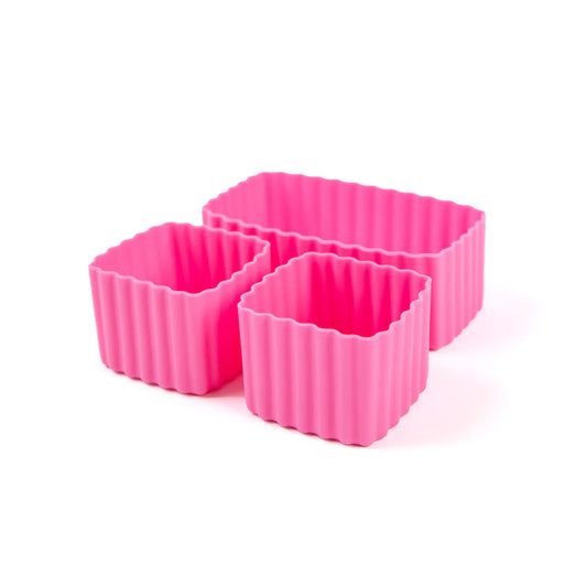 Set of three pink floss silicone bento cups on a white background