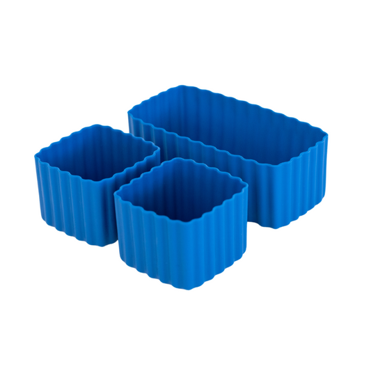 Set of blue reef MontiiCo mixed bento cups with fluted sides, shown in multiple sizes for organising snacks in lunch boxes."