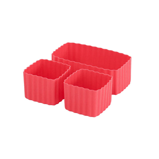 Set of three red silicone bento cups on a white background