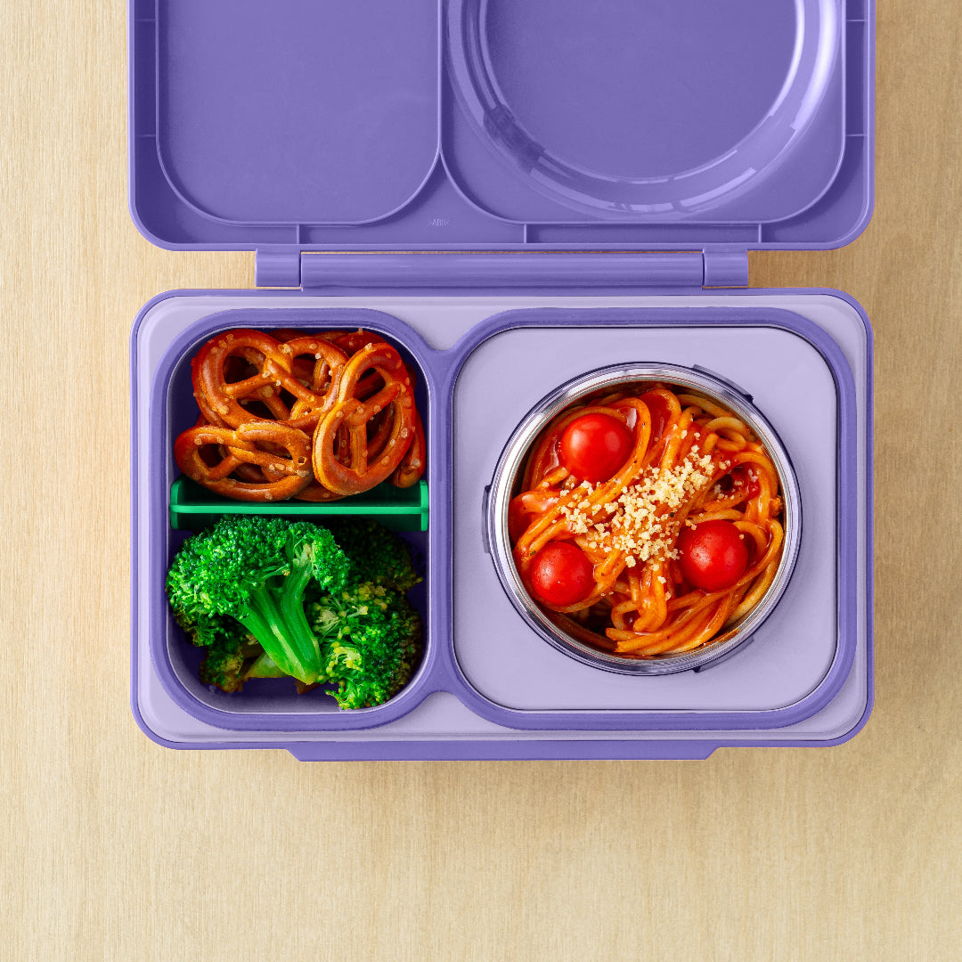 Top view of the Galaxy Purple OmieBox Up hot and cold bento box showing thermos lunch box filled with pasta, snacks and veggies as a grown up lunch container.