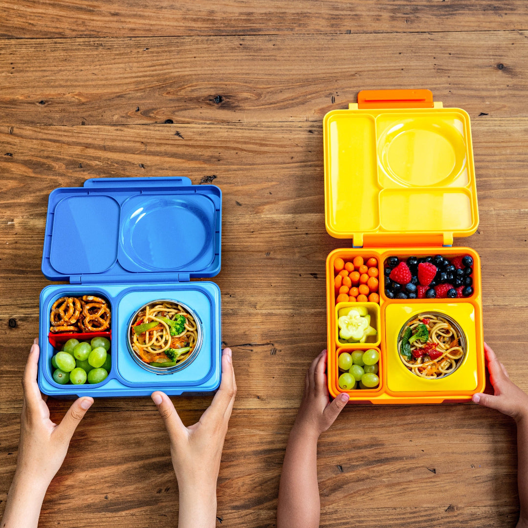 op view of the Galaxy Purple OmieBox Up hot and cold bento box showing deep compartments filled with pasta, pretzels and broccoli as a grown up lunch container.
