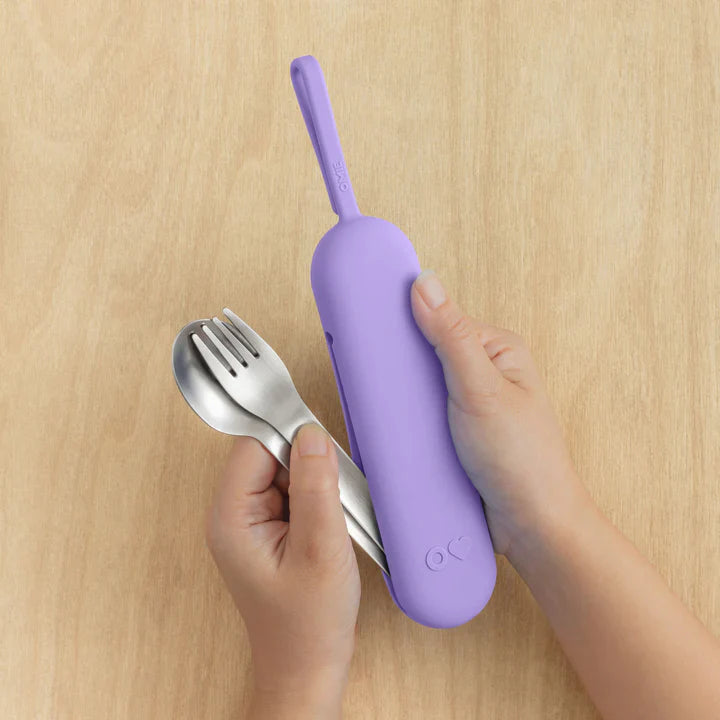Purple OmieBox Up cutlery pod held in hand showing compact bento cutlery design.