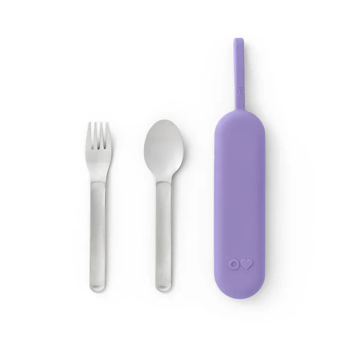 A Stainless steel lunch box cutlery set with purple OmieBox Up pod, fork and spoon.with a looped handle, along side a stainless steel fork and spoon, designed to be attached to the pod.