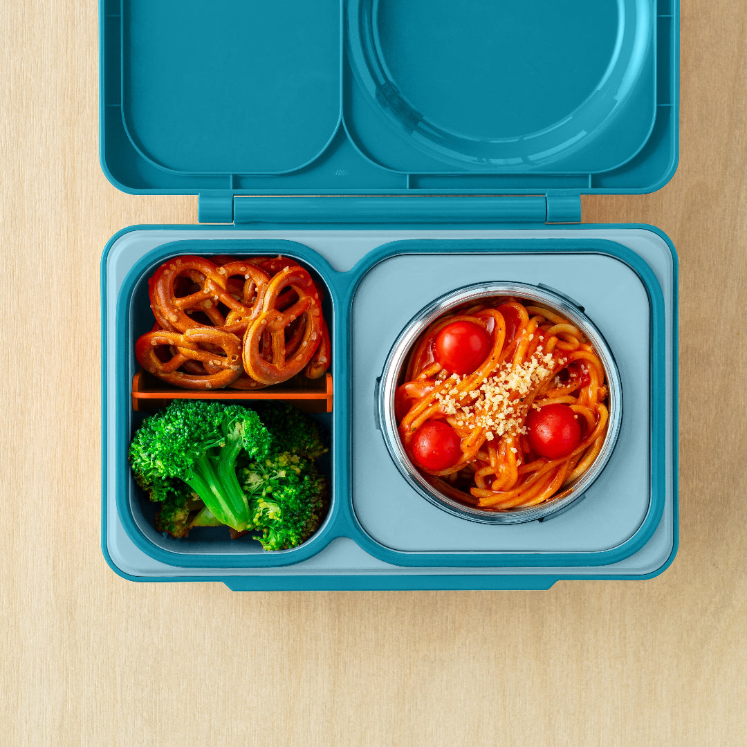 Teal Green OmieBox Up bento lunch box with deep compartments holding pasta, vegetables and fruit as a grown up lunch container.
