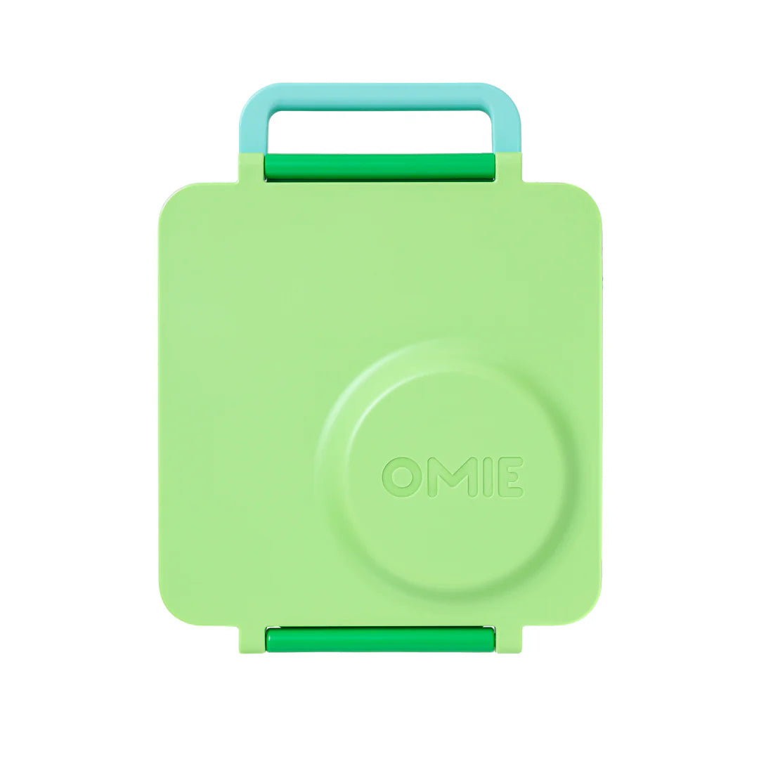 Apple Green OmieBox V2 leakproof bento lunch box shown closed with carry handle.