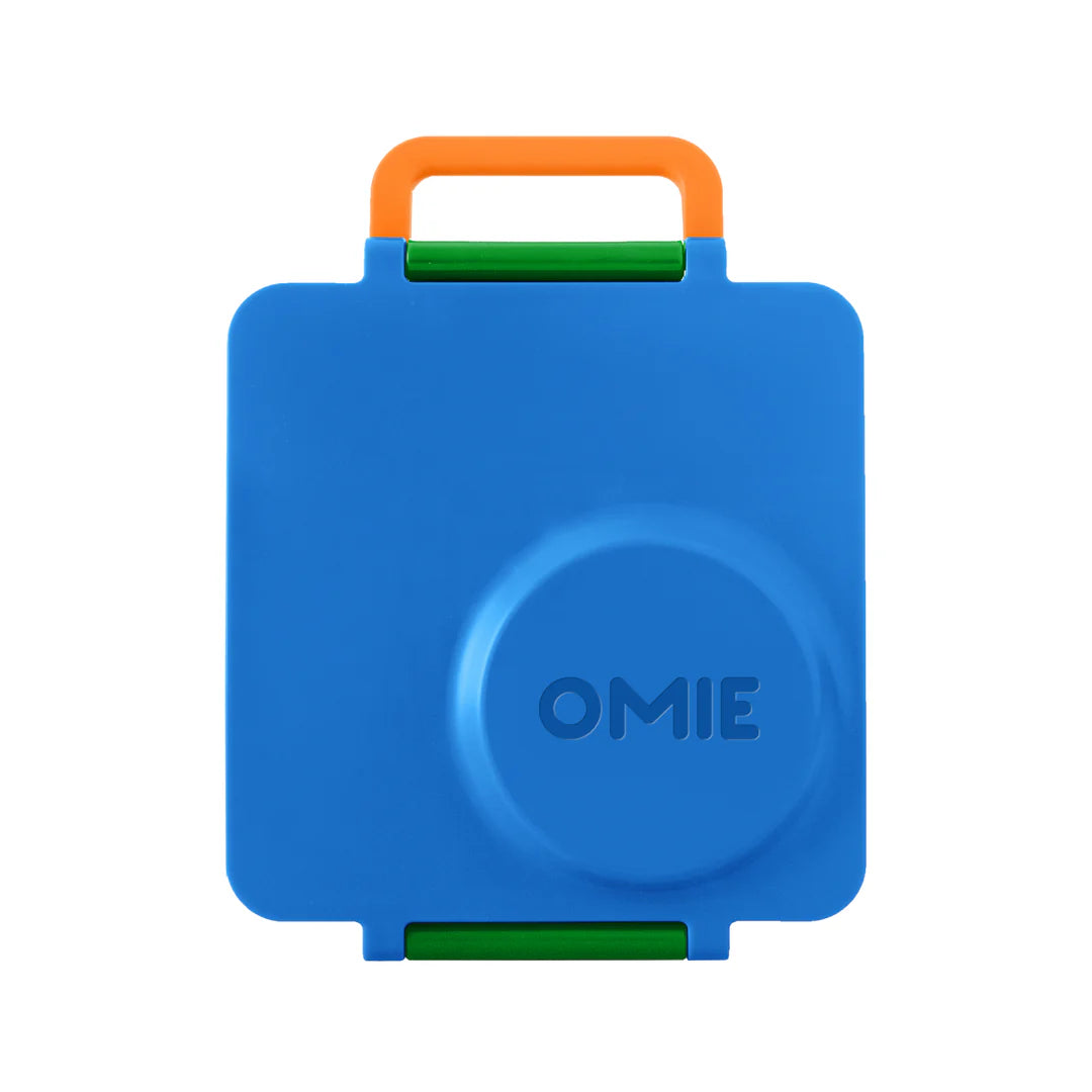 Monster Blue OmieBox V2 leakproof bento lunch box shown closed with sturdy carry handle.