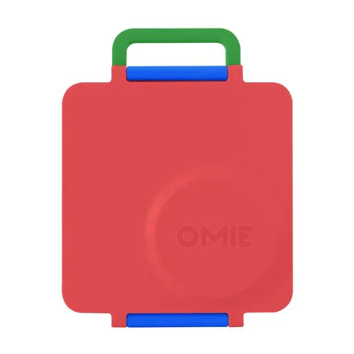 Scooter Red OmieBox V2 leakproof bento lunch box shown closed with sturdy carry handle.