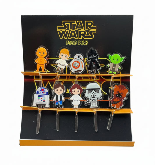 A set of Star Wars themed acrylic food picks displayed on a card, featuring various characters like Chewbacca, R2D2, and a Stormtrooper.
