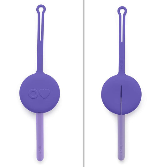 Purple Omie cutlery pod with nesting utensils and a soft silicone travel case.