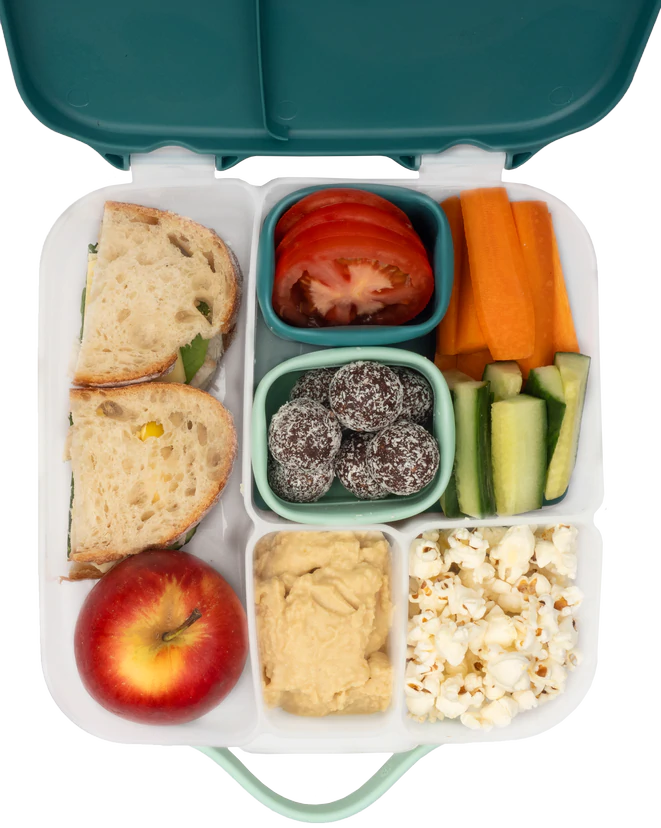 Forest b.box silicone snack cups holding snacks on a tabletop